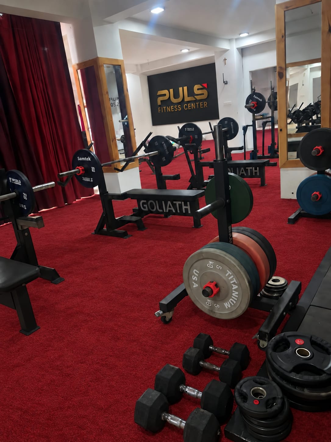 PULS gym benches, barbells, and weight plates